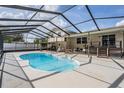Backyard enclosed pool with seating area, making it perfect for entertaining friends and Gathering at 206 Soldier Ct, Seffner, FL 33584