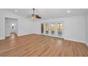 Bright and spacious living room with hardwood floors and French doors leading to the patio at 2200 Horan S Way, Gulfport, FL 33707
