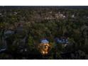 Aerial view of a private wooded estate with a modern home and lush landscaping at 4701 Rambling River Rd, Brandon, FL 33511