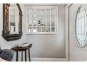 Well-lit foyer with decorative wall cut-out and view through to the living room at 610 N Woodlynne Ave, Tampa, FL 33609