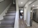 Inviting entryway featuring hardwood floors, neutral paint, and an open layout to the kitchen and living area at 9007 Pebble Creek Dr # 9007, Tampa, FL 33647