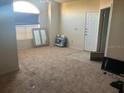 Spacious living room featuring carpet flooring and natural light from a large window at 10764 70Th Ave # 4302, Seminole, FL 33772