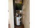 Compact water heater unit installed in a utility closet at 10764 70Th Ave # 4302, Seminole, FL 33772