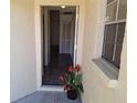 Inviting entryway featuring a tiled floor, a hall closet, and natural light at 3625 Simcoe Ct, Palm Harbor, FL 34684