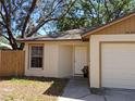 Charming one-story home featuring an attached garage, landscaped yard and covered front porch at 3625 Simcoe Ct, Palm Harbor, FL 34684