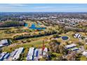 Stunning aerial view of the property surrounded by lush green golf courses and mature trees at 3681 Trophy Blvd # 6, New Port Richey, FL 34655