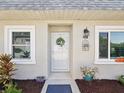 Close-up of the home's front door, showcasing its welcoming entrance and charming details at 3681 Trophy Blvd # 6, New Port Richey, FL 34655