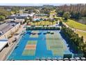 Aerial view of well-maintained tennis and pickleball courts, perfect for recreation and sports at 3681 Trophy Blvd # 6, New Port Richey, FL 34655