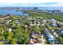 Stunning aerial view showcases the neighborhood's proximity to water and community greenery at 7591 Harbor View Way, Seminole, FL 33776