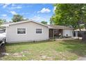 Attractive home with an attached garage, well-kept lawn, and a charming front entrance, perfect for a Gathering at 9414 Northcliffe Blvd, Spring Hill, FL 34606
