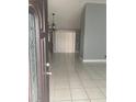 Entryway with tile floors, a chandelier, and large windows providing natural light at 10106 Wheatley Hills Ct, Tampa, FL 33615