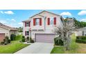 A lovely two-story home with red shutters and well-maintained landscaping at 1105 Canyon Oaks Dr, Brandon, FL 33510