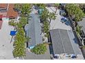An aerial view showcases the layout of two houses and sandy yard with landscaping at 13123 4Th E St, Madeira Beach, FL 33708