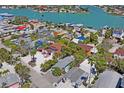 Waterfront neighborhood aerial view, showing roofs and nearby beach access at 13123 4Th E St, Madeira Beach, FL 33708