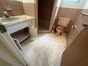 Small bathroom with a step-in shower and older fixtures at 5137 Manor Dr, New Port Richey, FL 34652