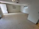 Bare living room with a white ceiling, white walls and neutral floors at 5137 Manor Dr, New Port Richey, FL 34652
