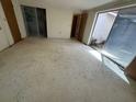 Spacious living room with sliding glass doors to the outside at 5137 Manor Dr, New Port Richey, FL 34652