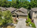 Beautiful aerial view of a single-Gathering home and a well-manicured lawn at 838 Vino Verde Cir, Brandon, FL 33511