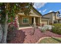 Charming single-Gathering home featuring a well-manicured lawn and a two-car garage at 838 Vino Verde Cir, Brandon, FL 33511