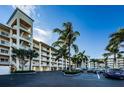 An exterior elevation of Boca Ciega shows the complex's architectural design and parking at 8800 Bay Pines Blvd # 303, St Petersburg, FL 33709