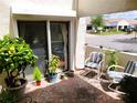 Cozy brick patio area with seating, potted plants, and a view of the neighborhood at 8810 41St N St, Pinellas Park, FL 33782