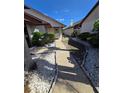 Landscaped walkway with decorative stone leading to the front entrance of the home at 10825 Venice Cir, Tampa, FL 33635