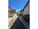 Stone walkway with trimmed shrubs leads to the inviting entrance of the home at 10825 Venice Cir, Tampa, FL 33635