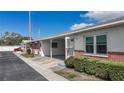 Well-kept villa with carport, brick accents, and easy access to a neat sidewalk at 12400 Park Blvd # 121, Seminole, FL 33772