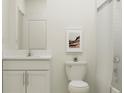 Bright bathroom with white vanity, framed mirror, and shower-tub combination with white tiling at 15276 Rainbow Quartz St, Wimauma, FL 33598