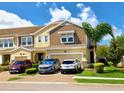 Charming two-story townhome with a well-manicured lawn, a two-car garage, and stylish exteriors at 2117 Lake Waters Pl, Lutz, FL 33558
