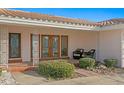 Charming front entrance with double doors, tile roof and garden at 2171 E Vina Del Mar Blvd, St Pete Beach, FL 33706