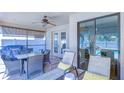 Covered patio with seating, ceiling fan and grill area, perfect for outdoor entertaining at 2515 Cross More St, Valrico, FL 33594