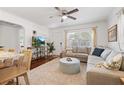 Open concept living room with a TV, sectional sofa, and hardwood floors at 2751 36Th N Ave, St Petersburg, FL 33713
