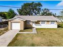 Charming single-story home featuring a blend of stucco and stone facade plus an attached single car garage at 428 Flamingo Dr, Apollo Beach, FL 33572