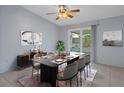 Charming dining room featuring a stylish table set, modern decor, and sliding glass doors for bright, airy space at 5814 Silver Moon Ave, Tampa, FL 33625