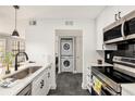 Updated kitchen with modern appliances and stacked washer and dryer at 1000 W Horatio St # 207, Tampa, FL 33606