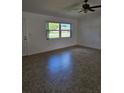 Bright living room featuring neutral tile flooring and a large window at 12619 98Th St, Largo, FL 33773