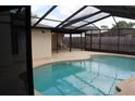 Inviting screened-in pool with patio, perfect for outdoor entertaining at 12619 98Th St, Largo, FL 33773
