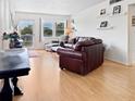Inviting living area with laminate floors and bright windows at 1325 58Th N St # 204A, St Petersburg, FL 33710