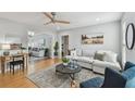 Bright and inviting living room featuring hardwood floors, comfortable seating, and lots of natural light at 1724 W Saint Conrad St, Tampa, FL 33607