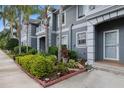 Charming condo with lush landscaping, mature palm trees and a well-maintained exterior at 18111 Paradise Point Dr, Tampa, FL 33647