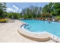 Community pool featuring lounge chairs and clear blue water at 2363 Newburg Ln # B, Safety Harbor, FL 34695