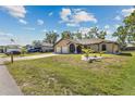 Well-maintained single-story home boasting a three-car garage, attractive landscaping and cozy entrance at 25337 Durango Ct, Punta Gorda, FL 33955
