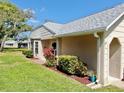 Charming single story house with well-maintained landscaping and a cozy front porch at 4851 Leyte Ct, New Port Richey, FL 34655