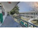 Exterior view of a condo complex with a long balcony hallway overlooking the courtyard at 5810 21St N St # 10, St Petersburg, FL 33714