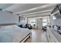 Well-lit studio with tile floors, seating area, and waterfront view at 611 Destiny Dr # 205, Ruskin, FL 33570