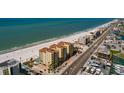 Aerial view showing building and surrounding neighborhood at 13600 Gulf Blvd # 700A, St Petersburg, FL 33708