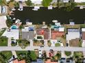 Aerial view showcasing property on a canal with a private dock and waterfront access at 1419 47Th Ne Ave, St Petersburg, FL 33703