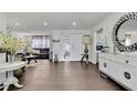 Elegant living room with sleek wood floors, recessed lighting, and an open layout that invites comfort at 215 Deer Park Ave, Temple Terrace, FL 33617