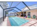 Inviting screened-in pool area perfect for relaxation and entertaining, with ample space for outdoor furniture at 2927 Hickory Grove Dr, Valrico, FL 33596